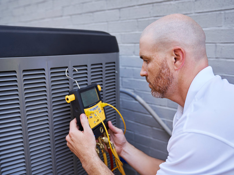 Man working on an air conditioner